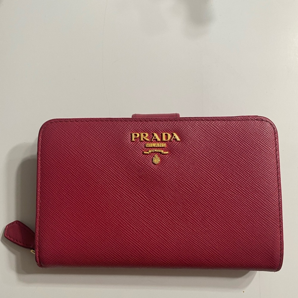 PRADA
Dark Pink Saffiano Leather Zip Wallet